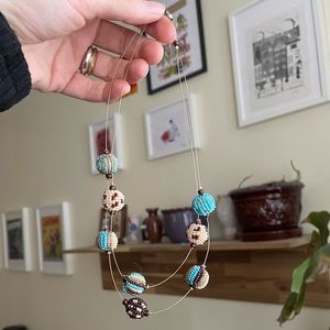 Double stranded beaded necklace in blue cream brown